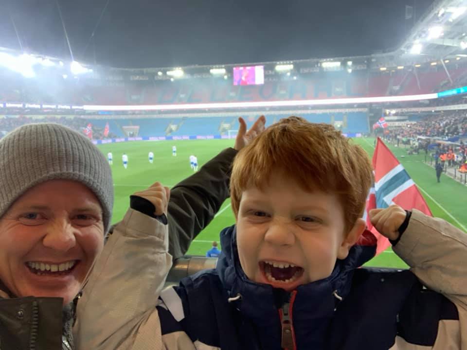 Roy Pedersen and son celebrating on the stands of the game between Norway vs. The Faroe Islands in 2019