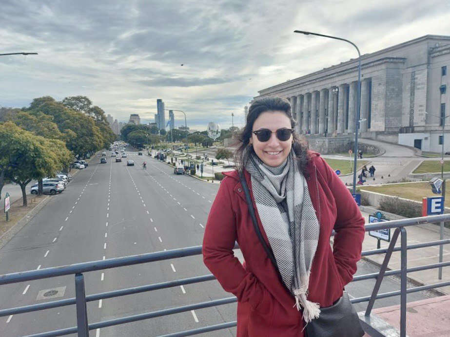 Ana Luiza with UBA University in the background